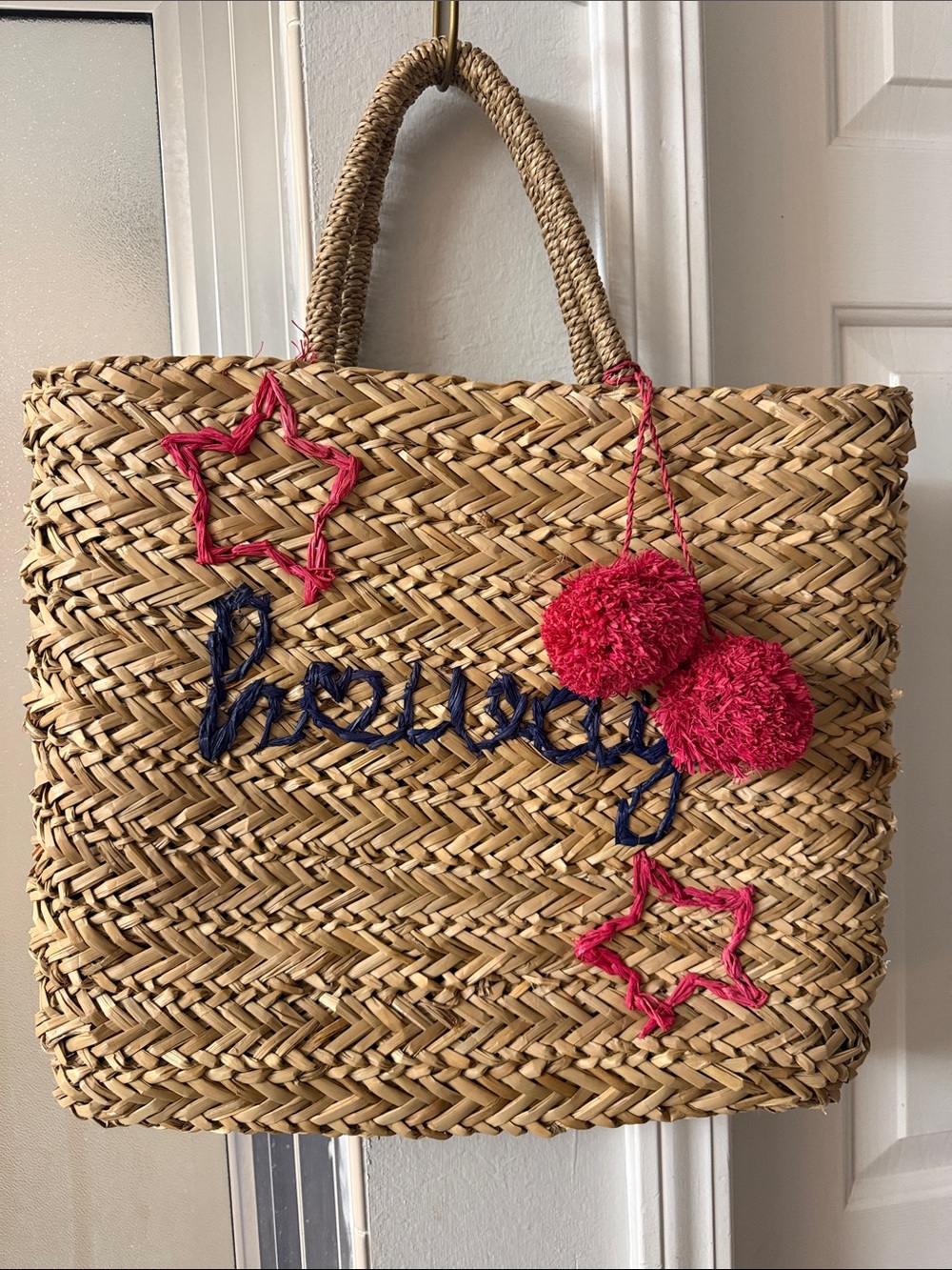 Draper James Straw Tote Bag with Pink Pom-Poms and Navy 'Howdy' Script